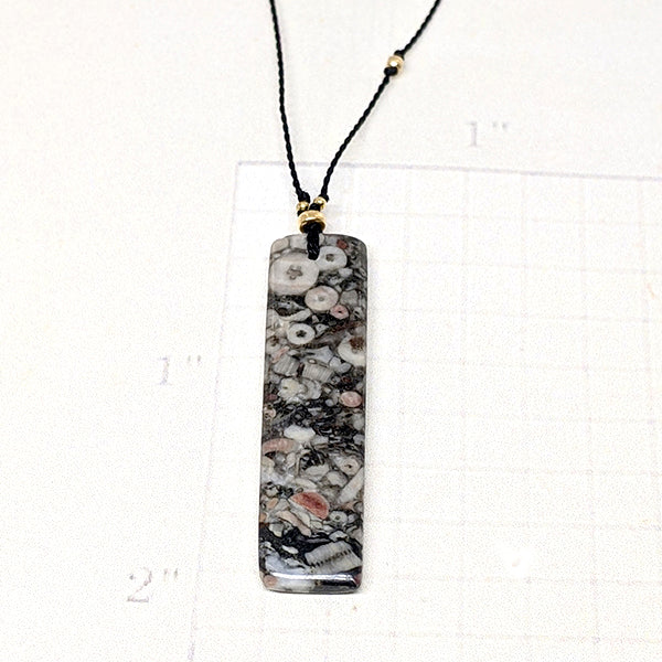 Mottled Black Crinoid Fossil Rectangle Cutstone Pendant 1