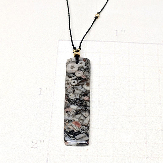 Mottled Black Crinoid Fossil Rectangle Cutstone Pendant