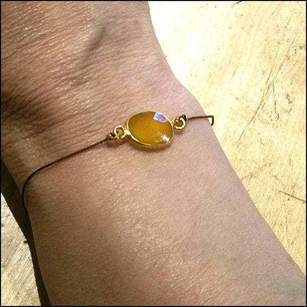 yellow sapphire and silk bracelet artisan jewelry ventura boulevard sherman oaks on wrist